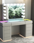 Makeup vanity table with mirror and LED lights in a room setting.
